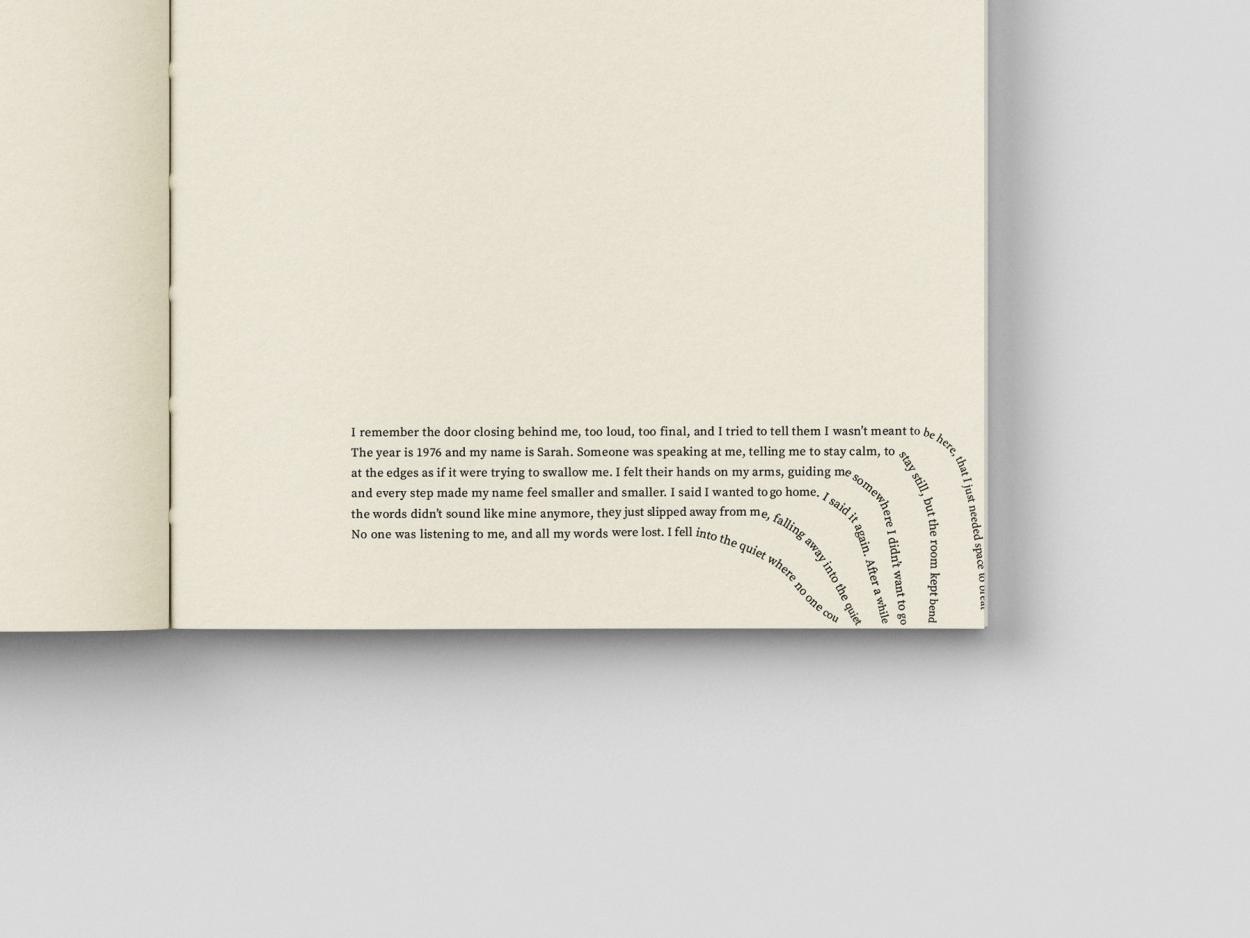 Minimalist book spread featuring text and expressive typography elements.