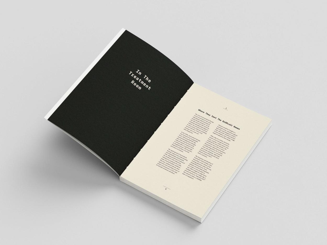 Open book mockup showing clean editorial layout with black cover and structured typography.