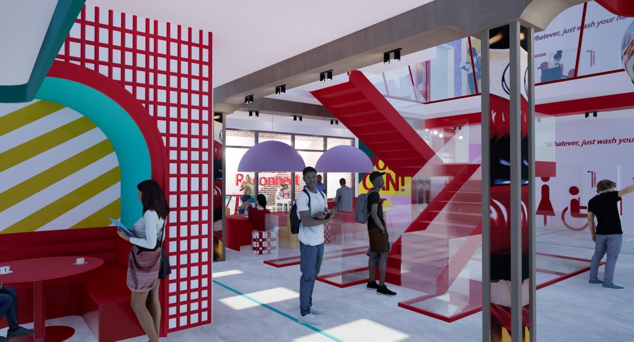 Open-plan entrance area with bright red staircase, seating booths, and colourful  geometric wall features creating a vibrant social hub.
