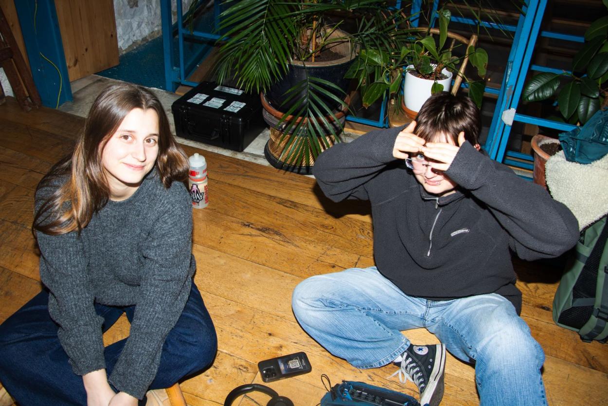 a group of people sitting on the ground