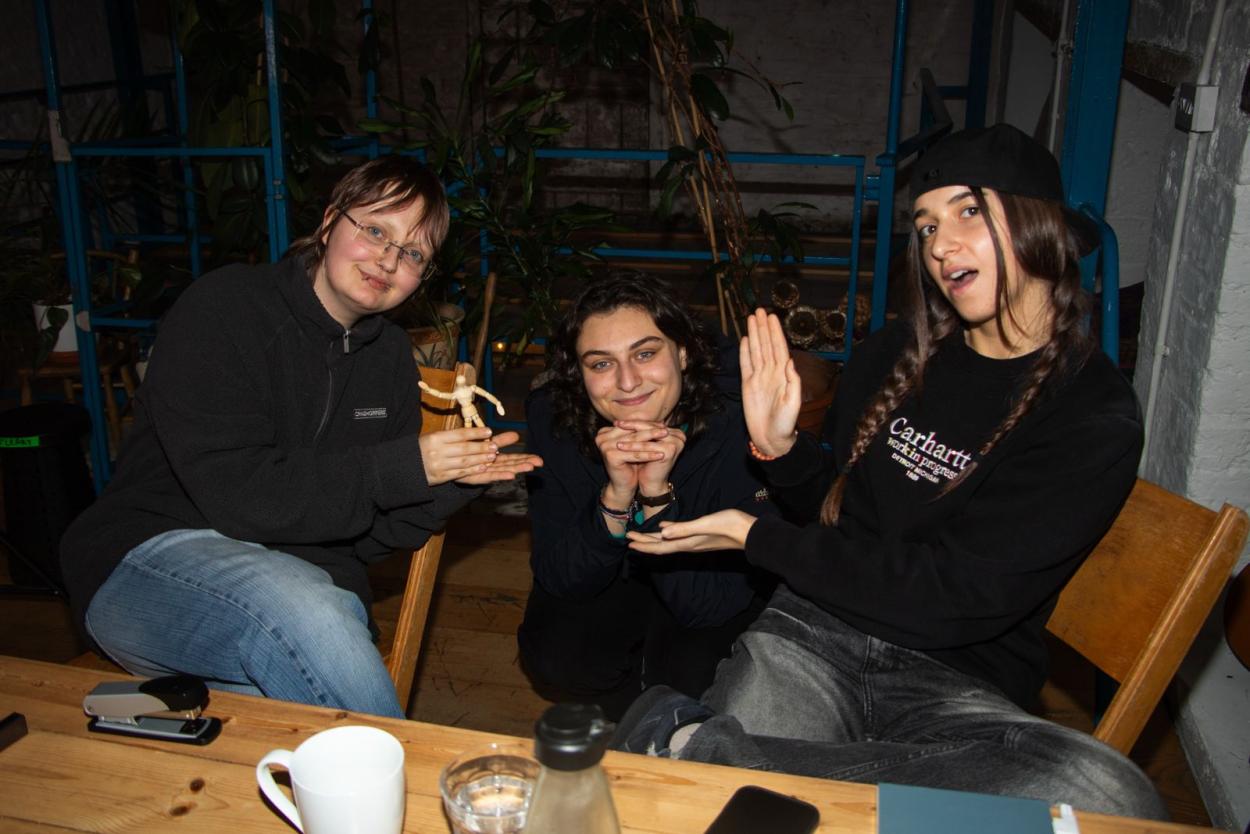 a group of people sitting at a table