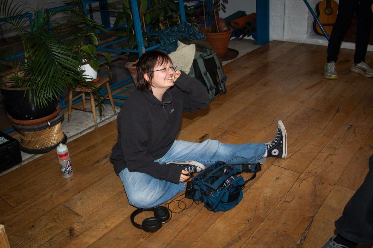 a young boy sitting on the floor