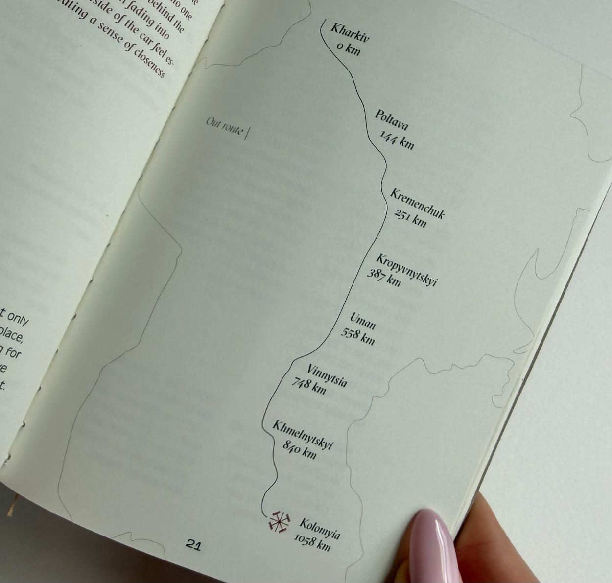 Book page displaying a minimalist map outline showing distances in kilometers from various Ukrainian cities.             