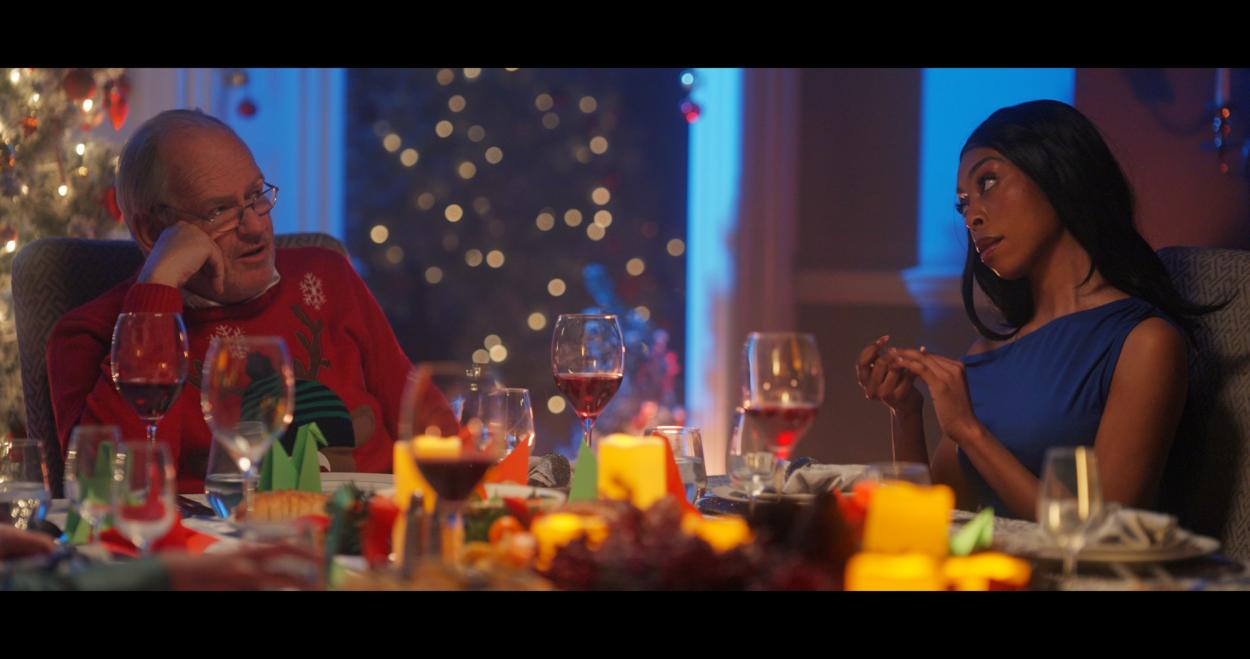 a group of people sitting at a table with wine glasses
