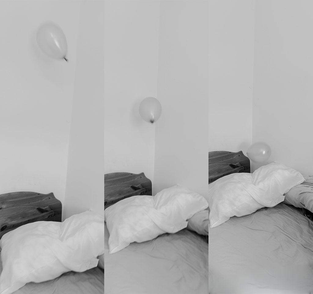  A black-and-white multi-frame image of a bedroom scene with floating balloons above an unmade bed and pillows.