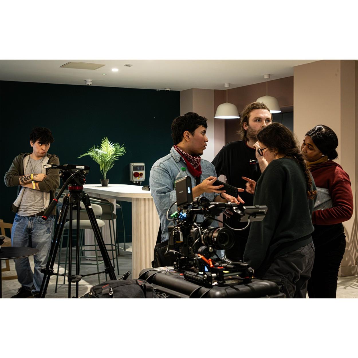 a group of people standing in a room