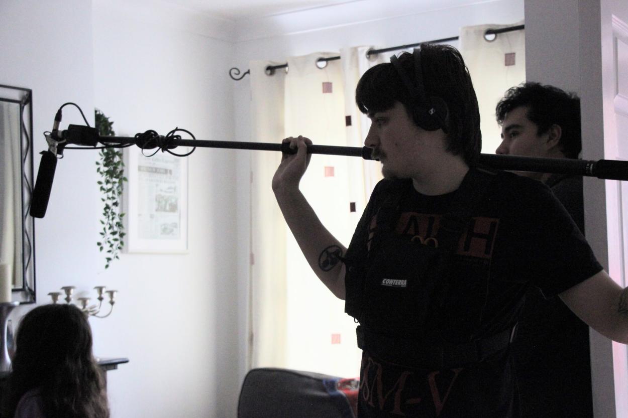 a man standing in front of a mirror posing for the camera