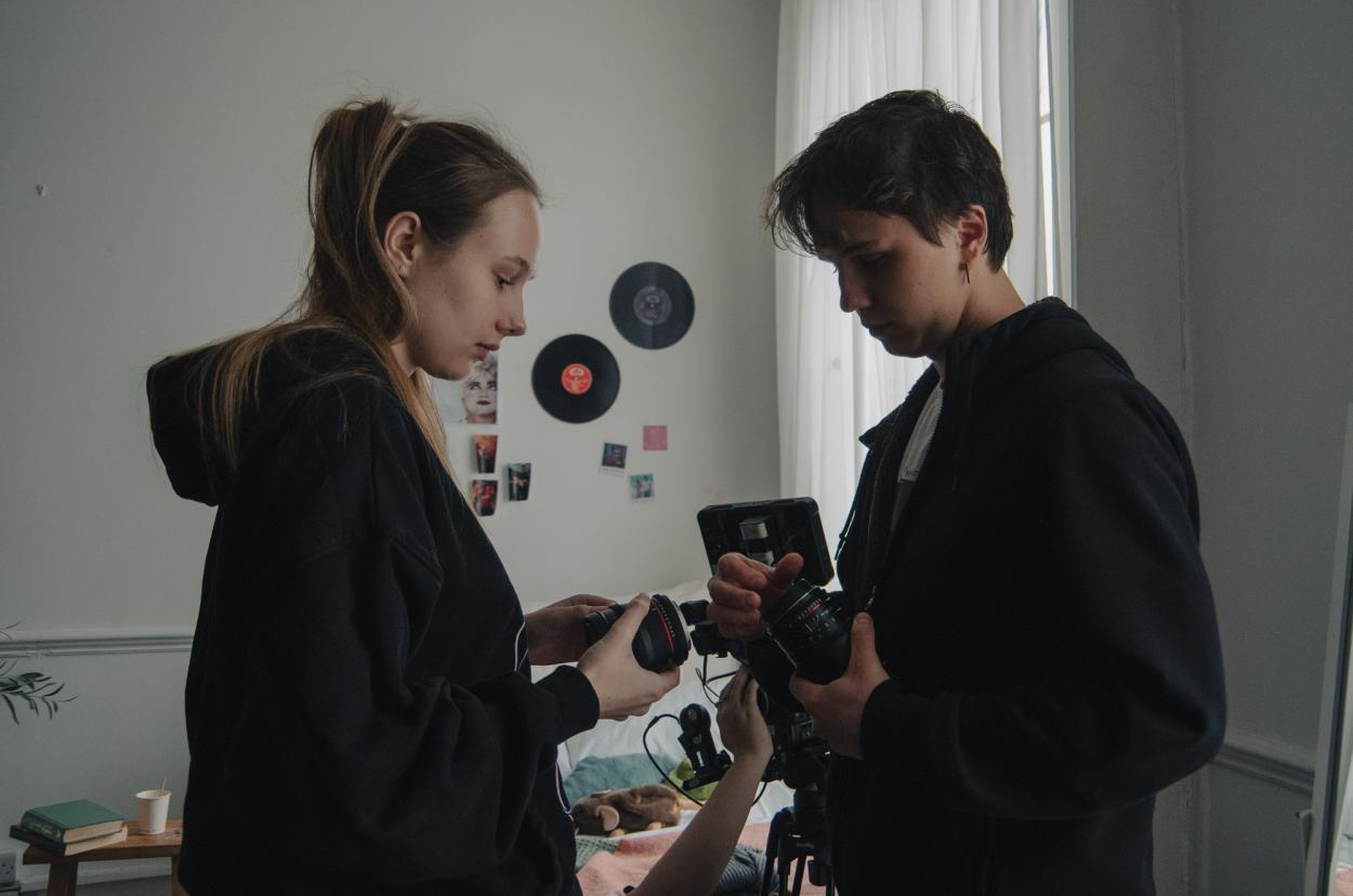 Working with the camera team on set.
