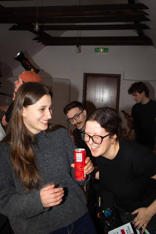 a group of people standing in a room