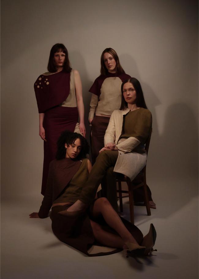 Four models posed against white backdrop