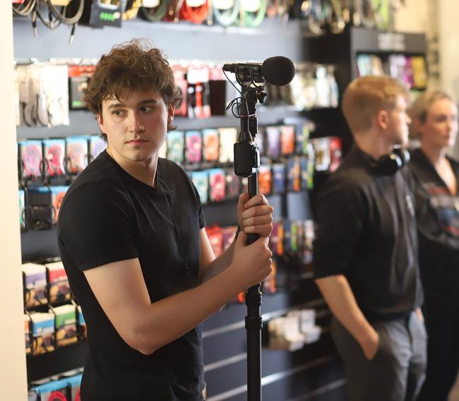 a man standing in front of a store