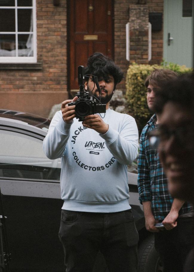 a person holding a camera
