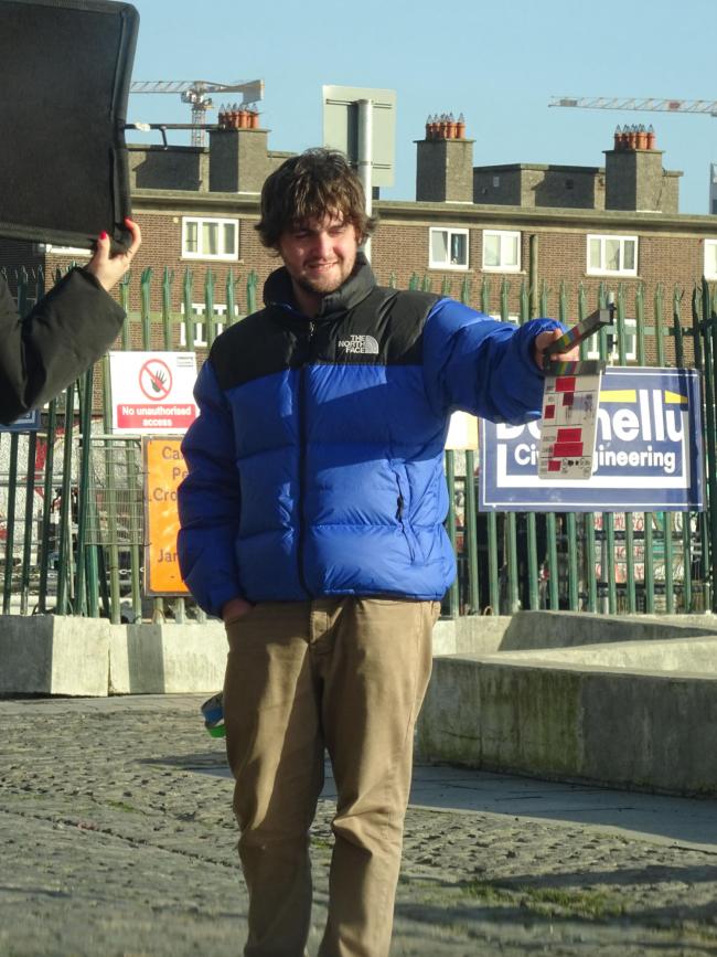 a person standing on a sidewalk