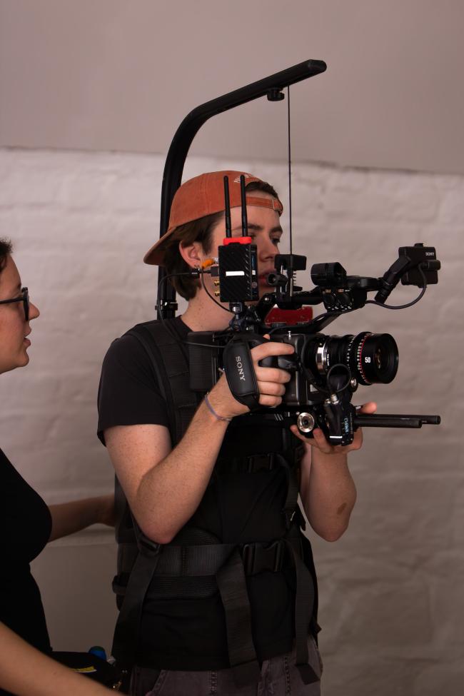 Man operating camera equipment 