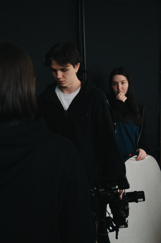 a man standing next to a woman