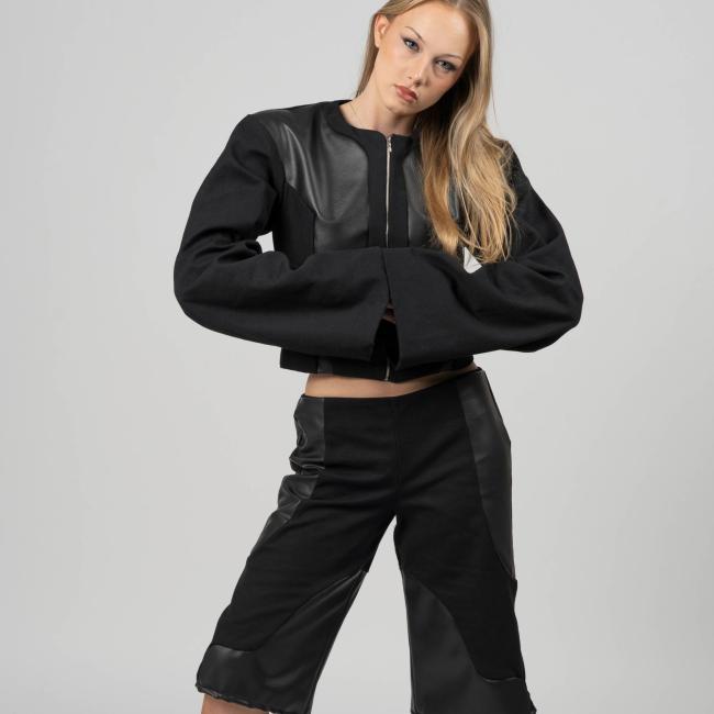 Model wearing Jacket & Jorts outfit made with vegan leather and canvas