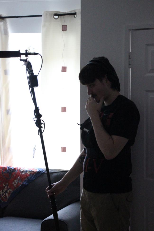 a person standing in front of a mirror posing for the camera