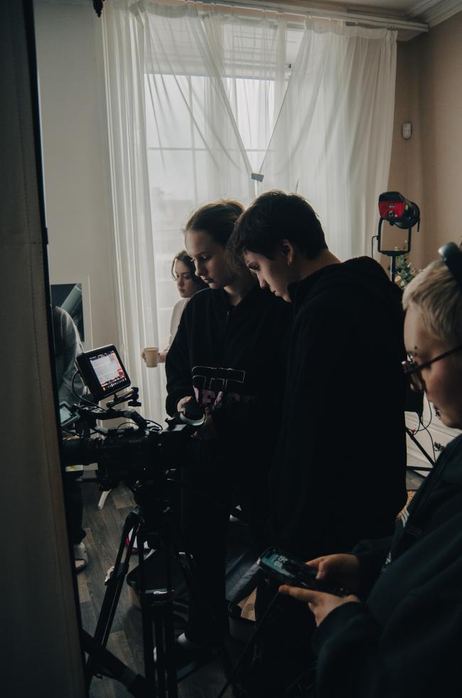 Supervising camera setup during a shoot.