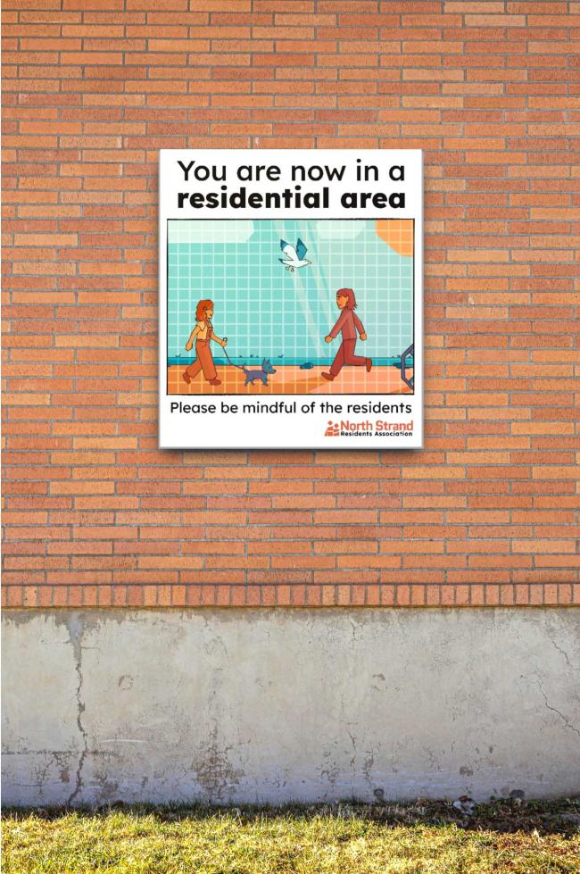 A sign with a cartoon of people walking and a caption “You are now in a residential area. Please be mindful of the residents”.