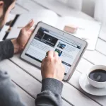 A person on tab browsing news