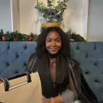 BAAFH graduate sitting at table