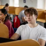 student in library