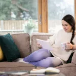 a woman sitting in a living room