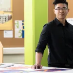 a person standing in front of a table