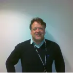 a man standing in front of a computer