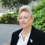a woman wearing a suit and tie