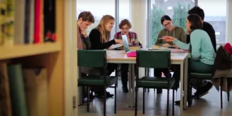 a group of people sitting at a table